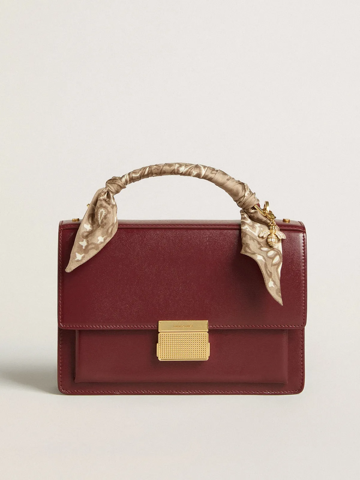 Venezia Bag in burgundy boarded leather with gold details